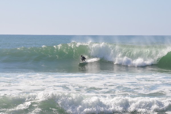 Action shot of Elaine surfing the Portugal waves