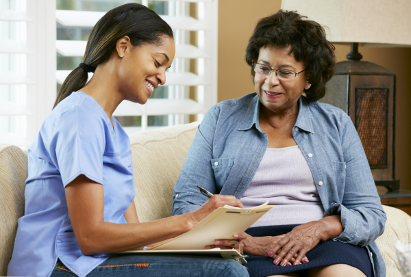 Agency nurse talking to her patient