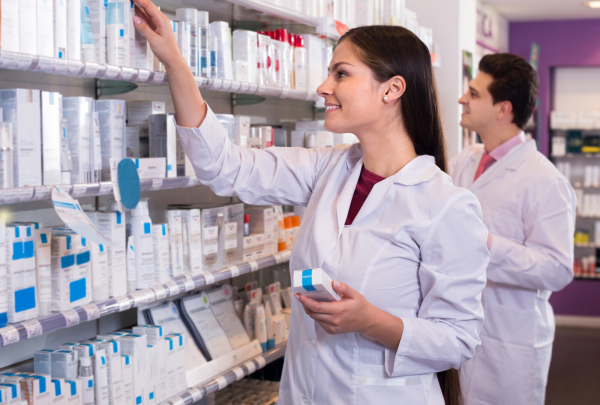 Pharmacist stocking shelves in the pharmacy