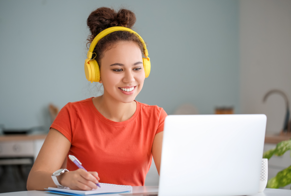 Woman smiling at her laptop