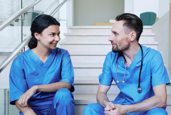 Two nurses talking on the stairs