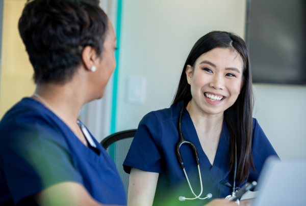 Nurse smiling at her colleague